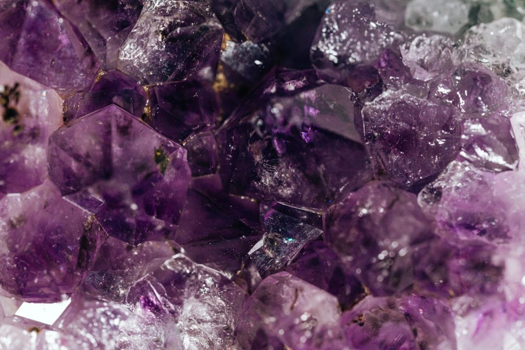 A deep purple Amethyst crystal gemstone for spiritual healing and protection, presented by Lydazz.