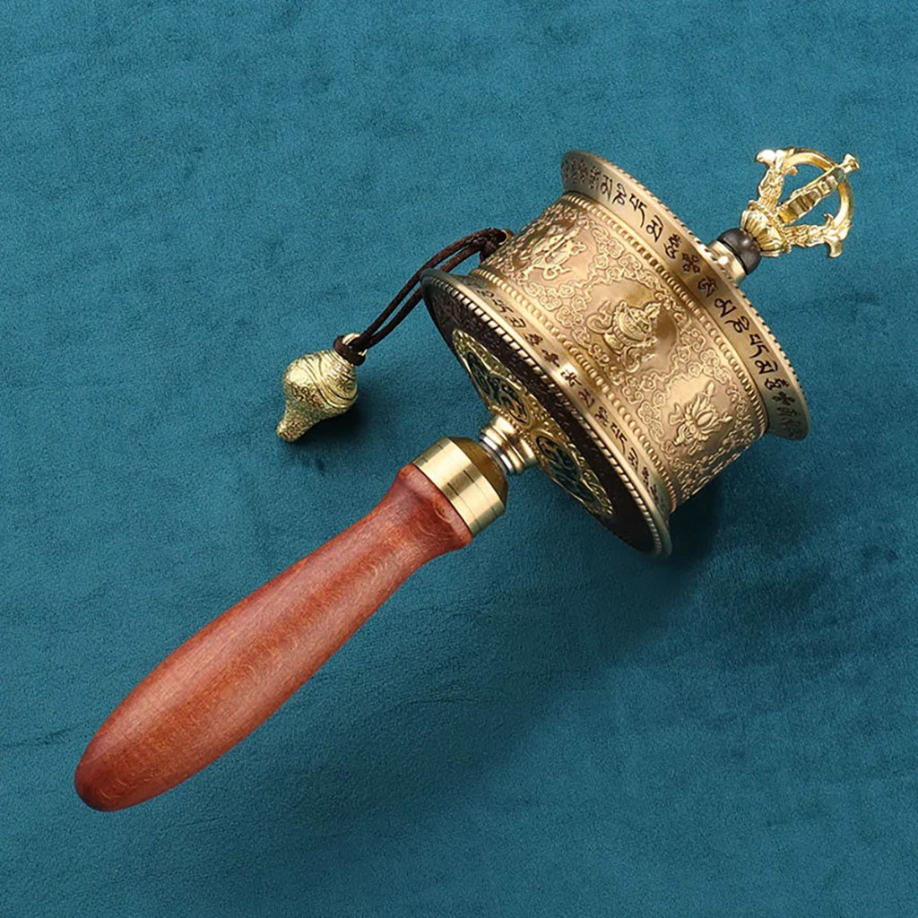 The prayer wheel is an important ritual instrument in spiritual practice. It contains coiled scriptures inside, and each rotation symbolizes the recitation of the sutras once, representing the accumulation of merit, purification of the mind, and the conveyance of blessings. It has evolved into a cultural symbol embodying the flow of wisdom and sincere well-wishing.

It is suitable for all modern individuals who respect traditional culture and seek moments of meditation and spiritual solace amidst their busy lives. Wearing jewelry inspired by its form is like carrying blessings and peace wherever you go, serving as a reminder to maintain goodwill and inner harmony with every turn.
