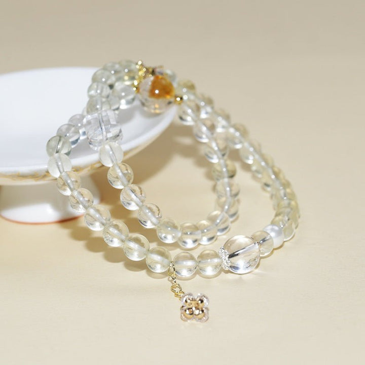 Abundance Duo Crystal Stackable Bracelet - Clarity &amp; Success - Prop styling shot of citrine and white crystal bracelet