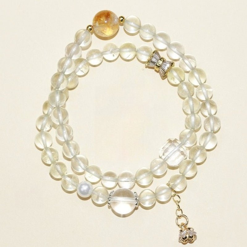 Abundance Duo Crystal Stackable Bracelet - Clarity & Success - Top view staged shot of citrine and white crystal bracelet