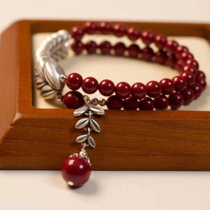 Abundant Harvest Wheat Sheaf Cinnabar Bracelet - Protection &amp; Prosperity - prop-styled shot