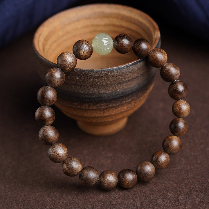 Agarwood &amp; Lotus Blossom Nephrite Jade Bracelet - Harmony &amp; Purity - prop-styled shot