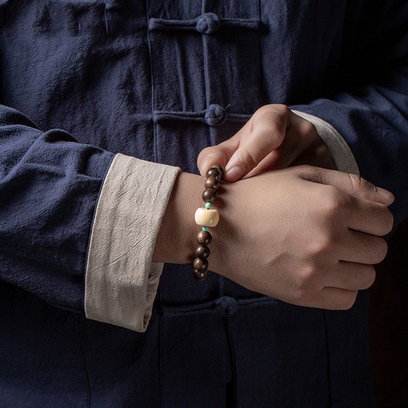 Black Sandalwood Bead Bracelet With Engraved Buddha Charm - Peace &amp; Grounding - On Wrist