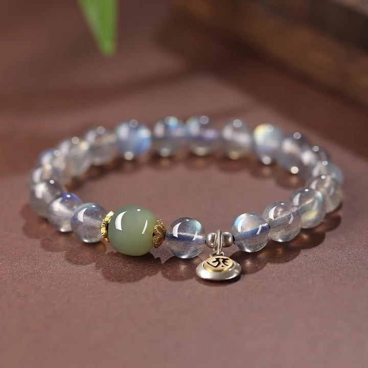 Calm Guardian Chinese Zodiac Buddha Charm Bracelet - Front view staged shot of white crystal and jade bracelet