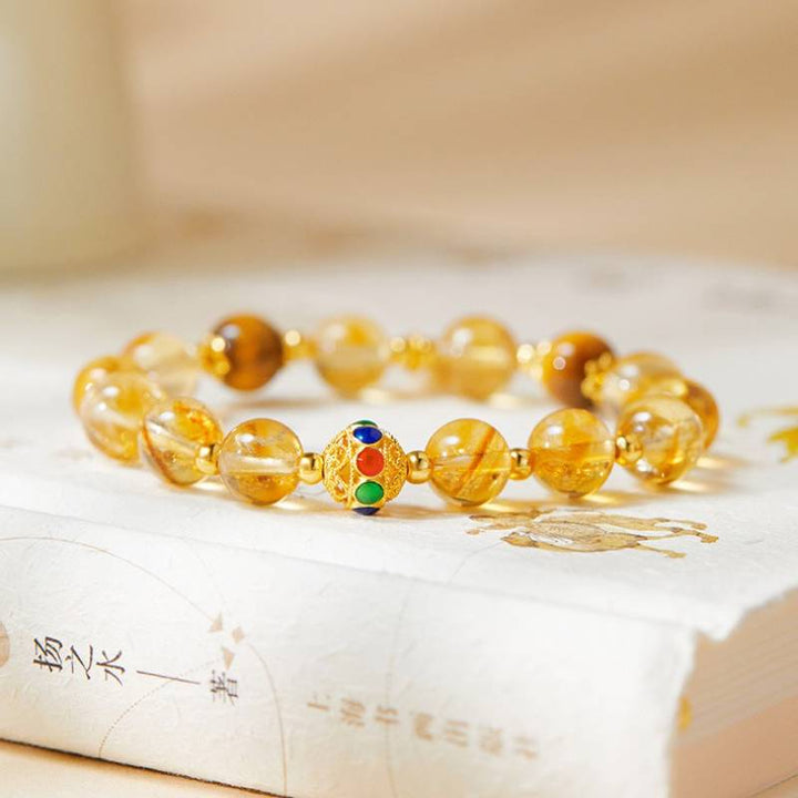Citrine Luck &amp; Fortune Bracelet - Abundance • Confidence • Flow - prop-styled shot focus on gold-plated silver master bead
