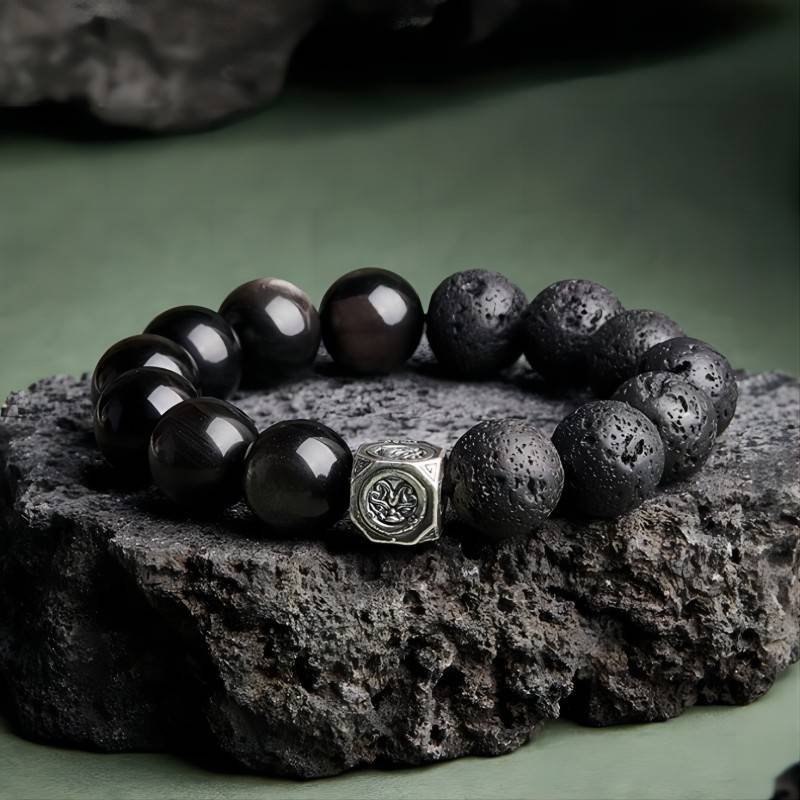 Ember Core Rebirth Bracelet - Resilience • Transformation - Staged shot of black obsidian and volcanic stone bracelet