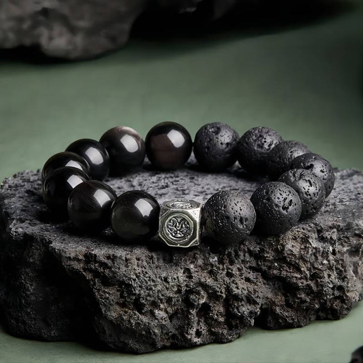 Ember Core Rebirth Bracelet - Resilience • Transformation - Staged shot of black obsidian and volcanic stone bracelet