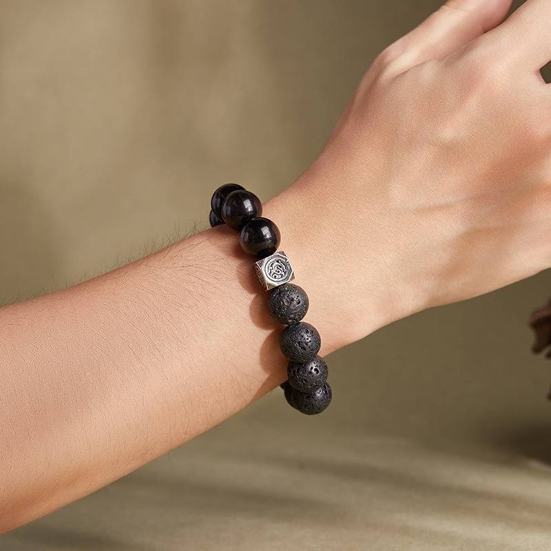 Ember Core Rebirth Bracelet - Resilience • Transformation - On wrist shot of black obsidian and volcanic stone bracelet