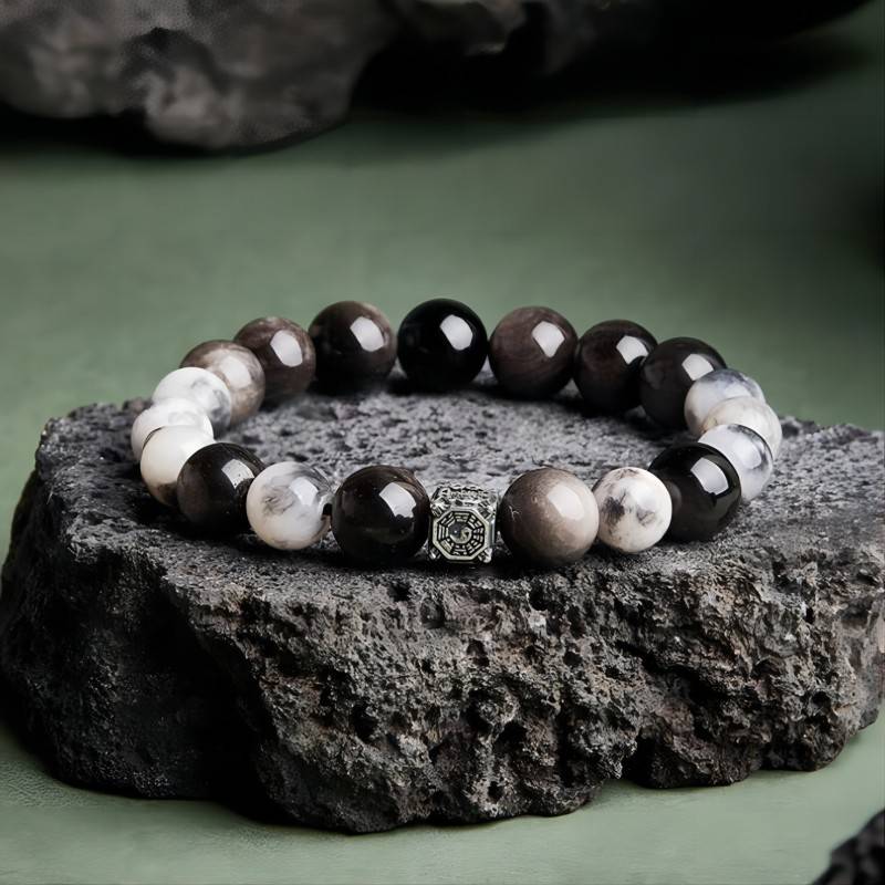 Feng Shui Yin Yang Bagua Charm Bracelet - prop-styled shot with black obsidian and blue tiger eye beads