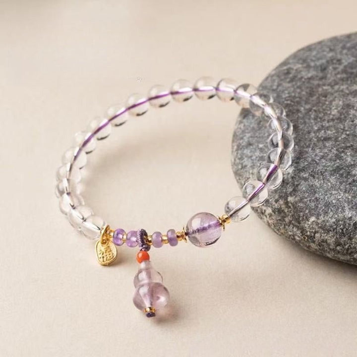 Fortune Gourd Amulet Bracelet - Clarity &amp; Balance - Side view stage shot of white crystal bracelet