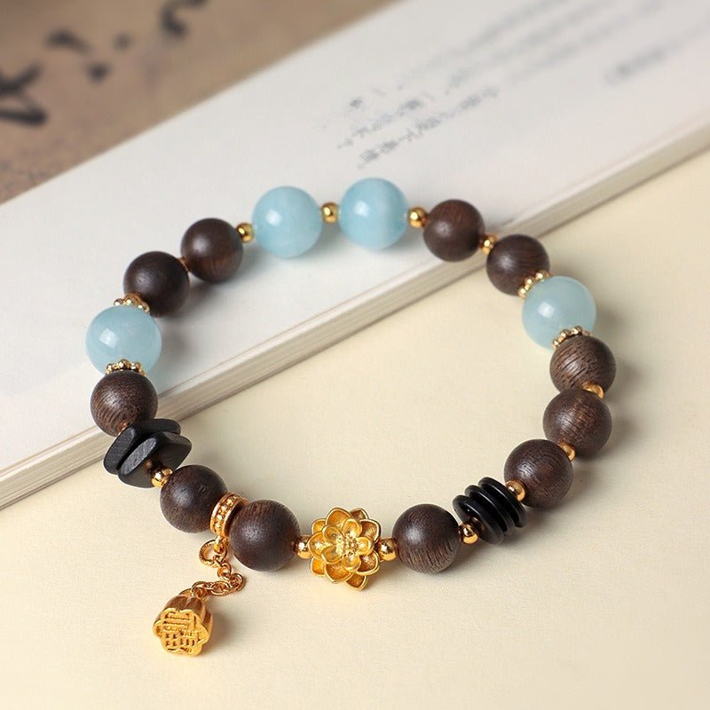 Golden Lotus Charm Agarwood & Aquamarine Beads Bracelet - Purity • Clarity • Serenity - front view