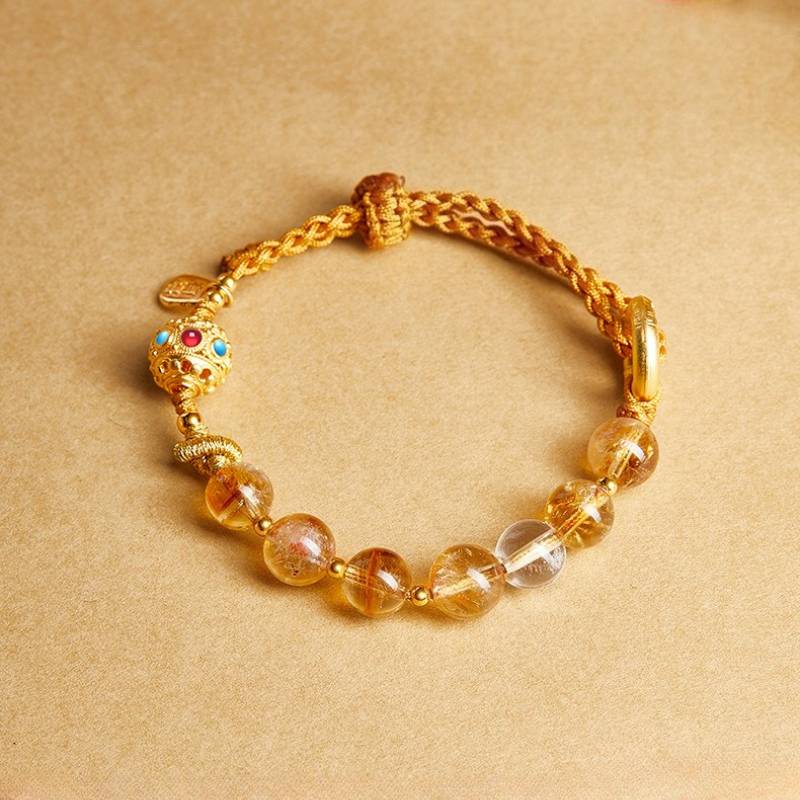 Golden Prosperity Knot Citrine Braided Cord Bracelet With Peace Buckle - top view staged shot