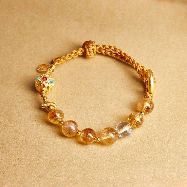 Golden Prosperity Knot Citrine Braided Cord Bracelet With Peace Buckle - top view staged shot