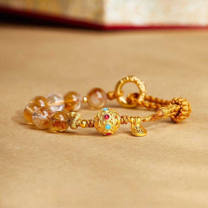Golden Prosperity Knot Citrine Braided Cord Bracelet With Peace Buckle - staged shot focus on silver-gilt master bead