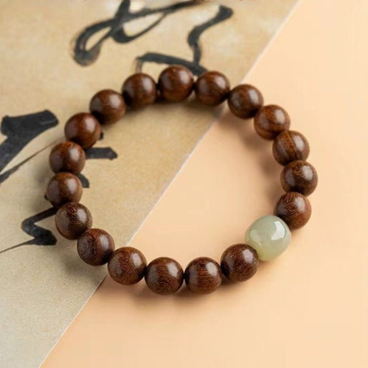 Golden Thread Sandalwood &amp; Mutton Fat Nephrite Jade Bracelet - Protection &amp; Good Fortune - top view prop-styled shot