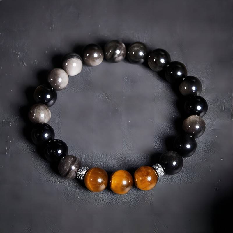 Grounded Confidence And Attract Wealth Bead Bracelet - Staged shot of obsidian and tiger eye bracelet