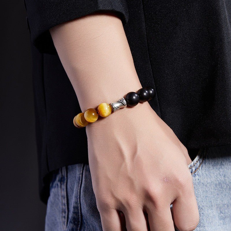 Grounded Confidence And Attract Wealth Bead Bracelet  - On wrist shot of black obsidian and tiger eye bracelet