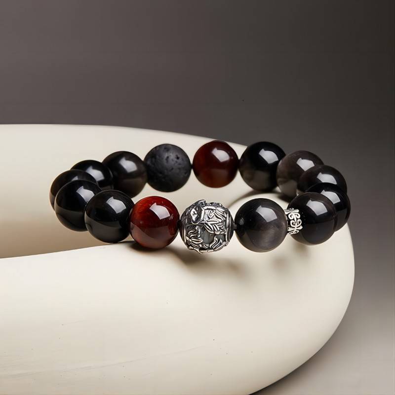 Grounded Confidence Bead Bracelet - Clarity & Resilience - Prop-styled shot with black obsidian tiger eye and volcanic stone