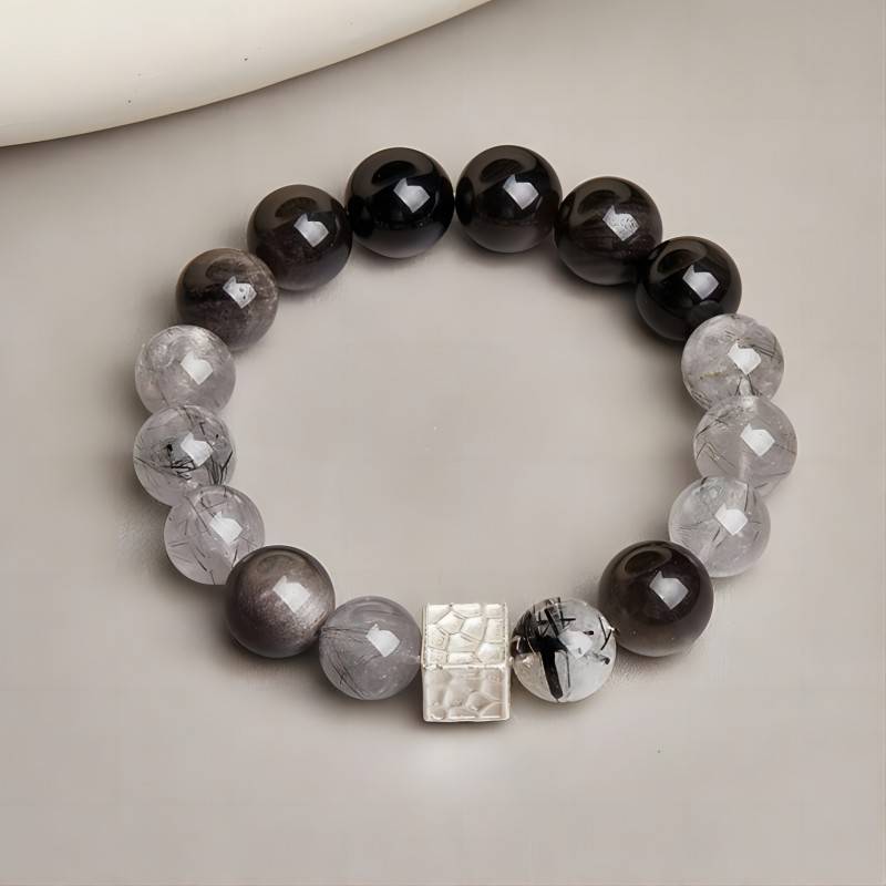 Grounded Confidence Bead Bracelet - staged shot with silver sheen obsidian and black rutilated quartz