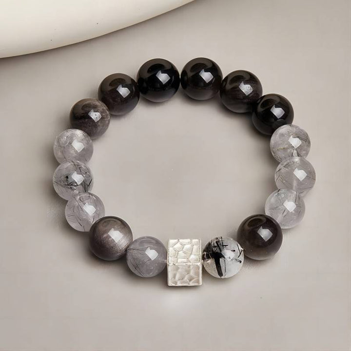 Grounded Confidence Bead Bracelet - staged shot with silver sheen obsidian and black rutilated quartz