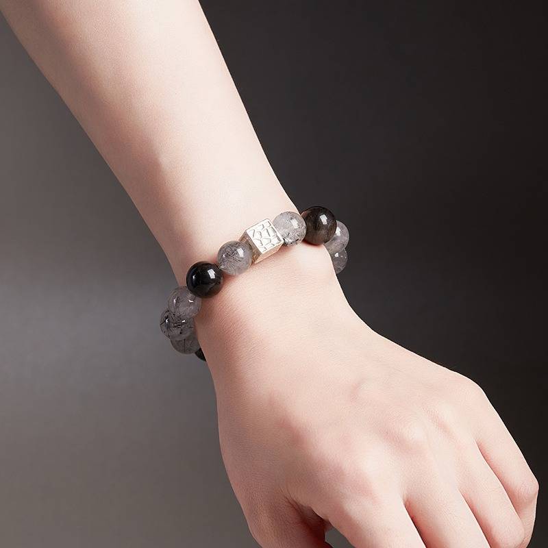 Grounded Confidence Bead Bracelet - on-wrist wearing display shot with silver sheen obsidian and black rutilated quartz