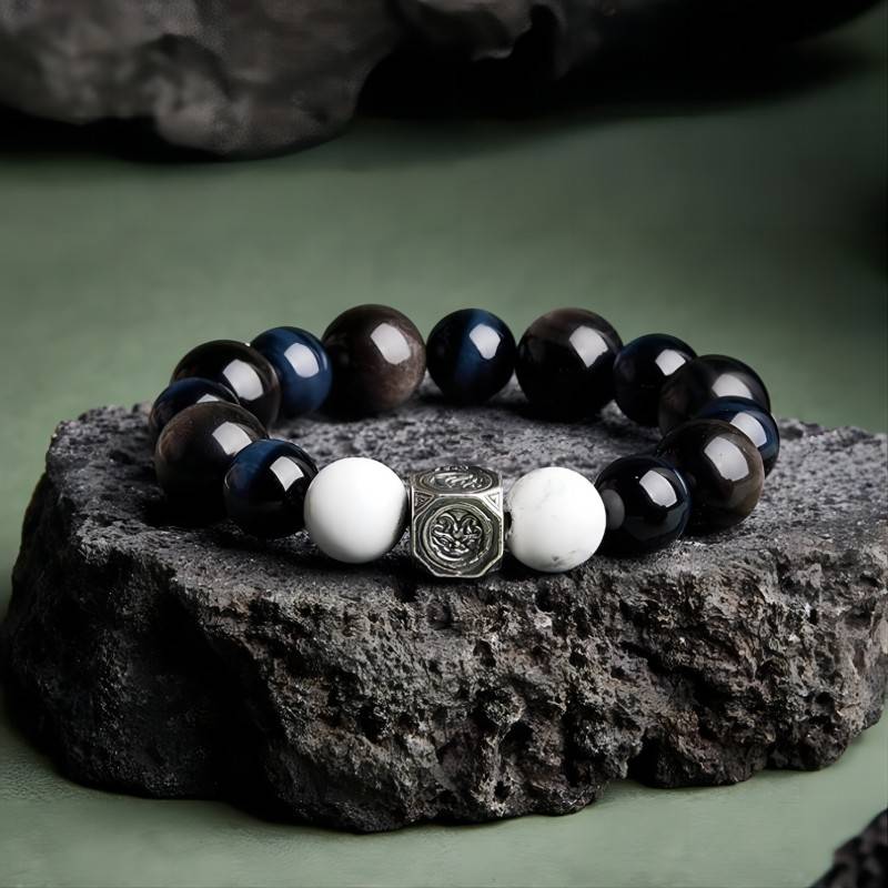 Grounded Confidence Bead Bracelet - Protection & Serenity - Front view prop styling shot of black obsidian bracelet