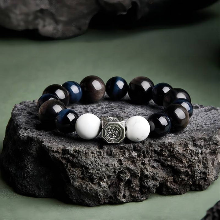Grounded Confidence Bead Bracelet - Protection &amp; Serenity - Front view prop styling shot of black obsidian bracelet