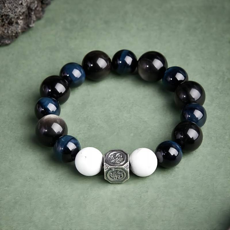 Grounded Confidence Bead Bracelet - Protection & Serenity - Top view staged shot of black obsidian bracelet