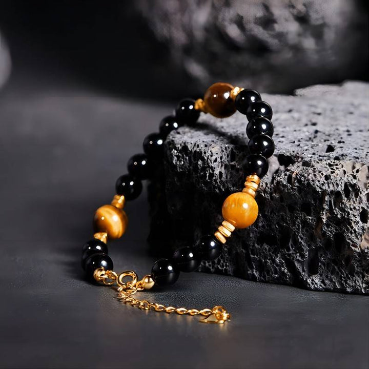 Grounded Confidence Black Obsidian And Tiger Eye Bead Bracelet - Wealth &amp; Protection - side view prop-styled shot