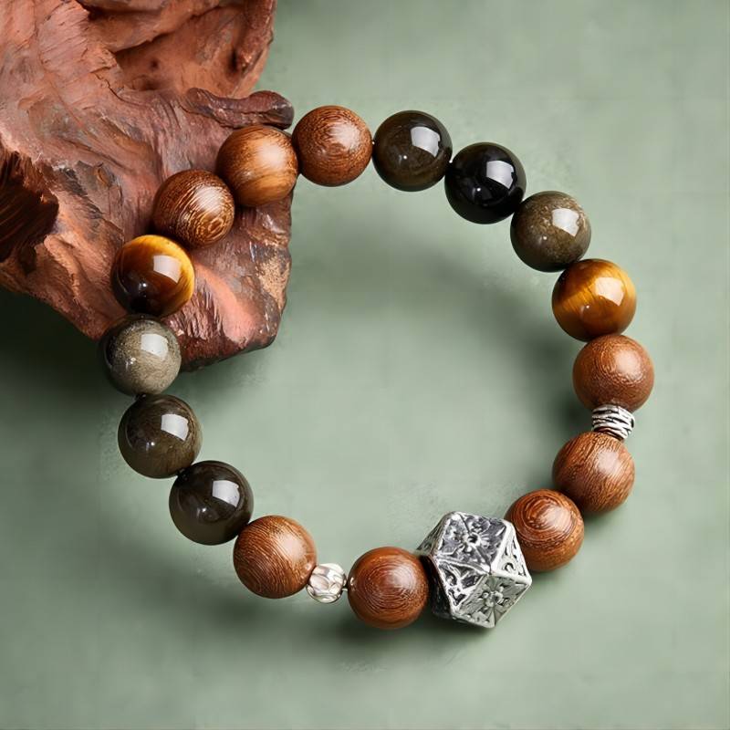 Grounded Confidence Sandalwood And Obsidian Bead Bracelet - Wealth & Protection - top view prop-styled shot