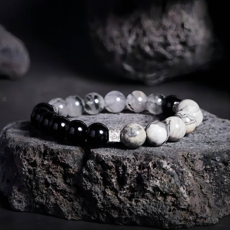 Grounded Confidence Cube Charm Bracelet - Style & Flow - Prop styling shot of black obsidian black rutilated quartz bracelet