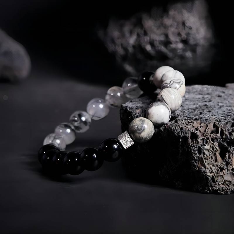 Grounded Confidence Cube Charm Bracelet - Side view staged shot of black obsidian black rutilated quartz bracelet