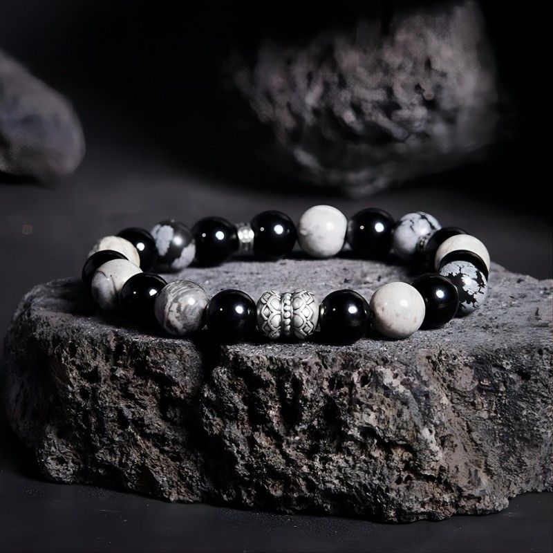 Grounded Elegance Bead Bracelet - Depth • Resilience • Style - Prop styling shot of black obsidian and map stone  bracelet