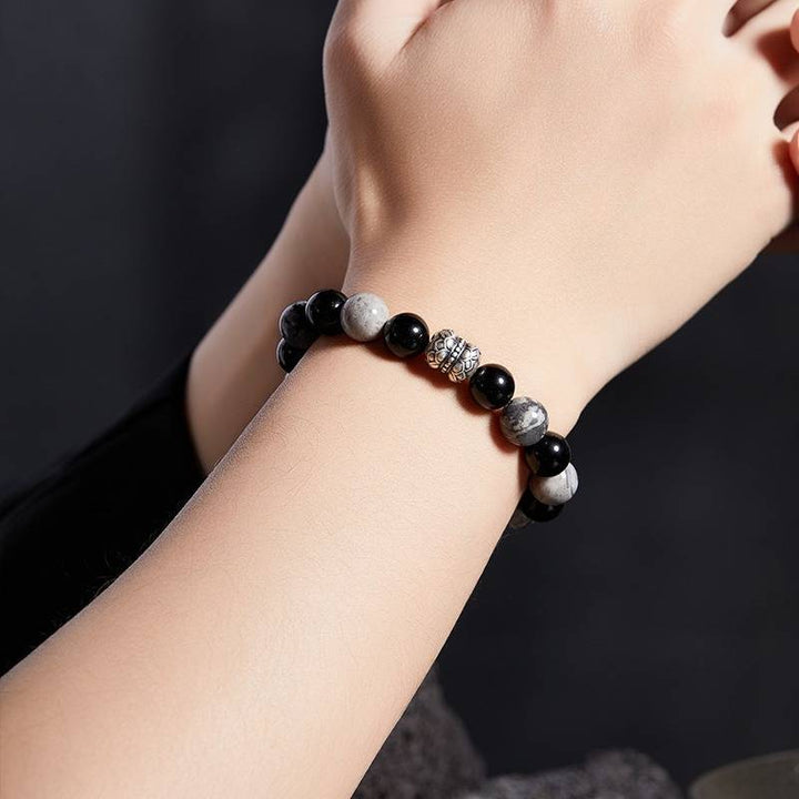 Grounded Elegance Bead Bracelet - On wrist wearing display shot of black obsidian and map stone  bracelet