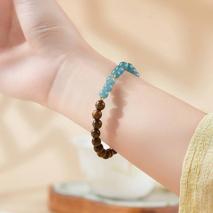 Grounded Harmony Sandalwood And Jadeite Bead Bracelet - Clarity • Prosperity • Spirituality - on-wrist shot