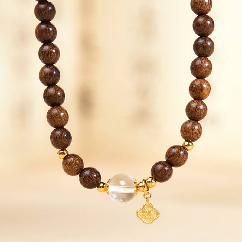 Grounded Harmony Double Wrap Sandalwood Bracelet With Gold-Plated Ruyi Pendant - Prosperity &amp; Clarity - close-up shot