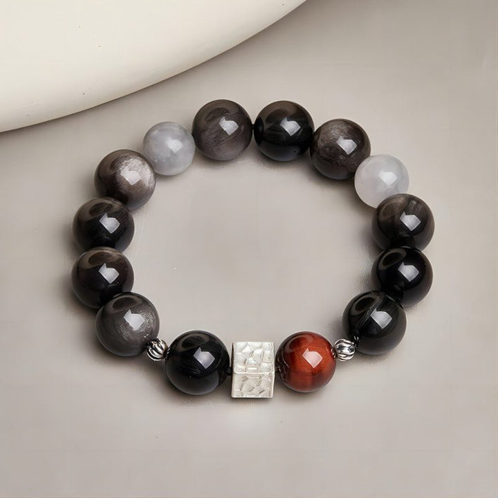 Grounded Power Bead Bracelet - Clarity • Courage • Fortune - Staged shot of black obsidian and tiger eye bracelet