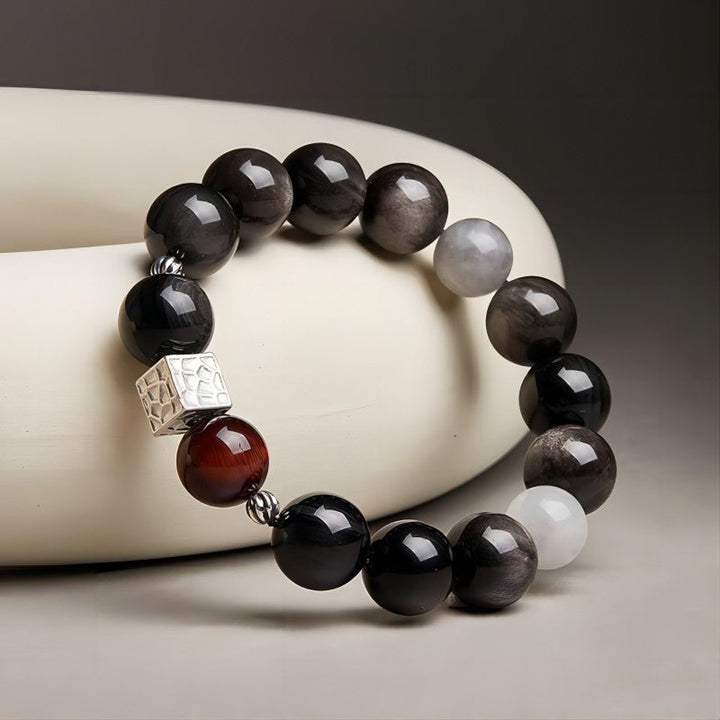 Grounded Power Bead Bracelet - Clarity • Courage • Fortune - Side view staged shot of black obsidian and tiger eye bracelet