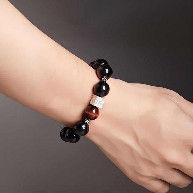 Grounded Power Bead Bracelet - Clarity • Courage • Fortune - On wrist wearing display shot of black obsidian and tiger eye bracelet