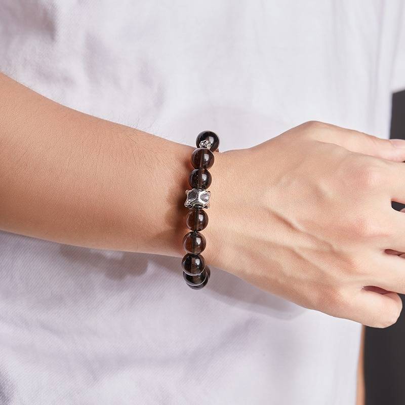 Grounded Protection Bead Bracelet - Calm &amp; Balance - On wrist shot of black bosidian and sandalwood bracelet