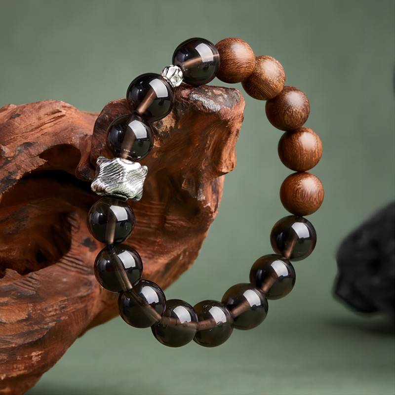 Grounded Protection Bead Bracelet - Calm &amp; Balance - On hand shot of black bosidian and sandalwood bracelet