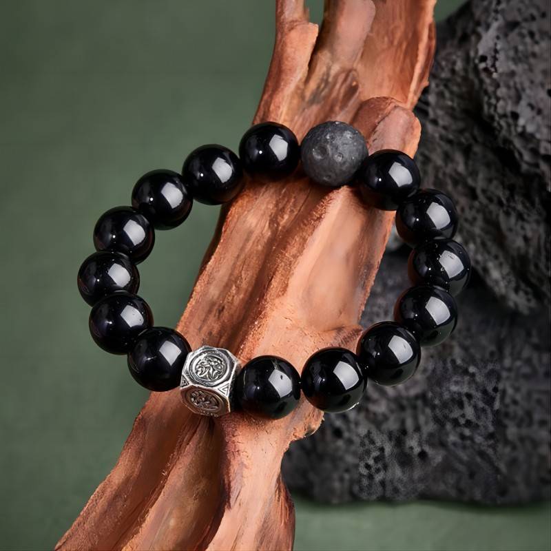 Grounded Protection Obsidian Bracelet - Prop styling shot with silver focal bead