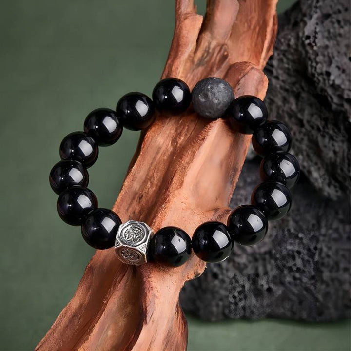 Grounded Protection Obsidian Bracelet - Prop styling shot with silver focal bead
