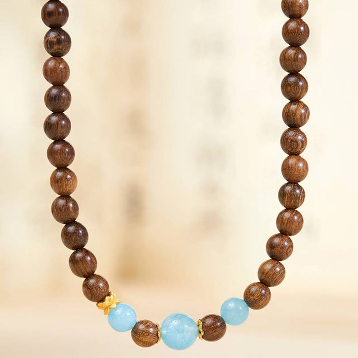 Grounded Serenity Double Wrap Sandalwood And Aquamarine Bracelet - Clarity • Communication • Harmony - close-up shot
