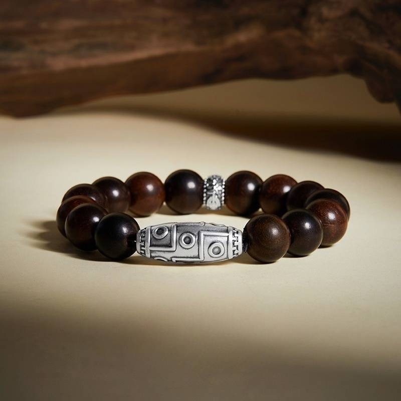 Grounded Wisdom Silver Nine - Eye Dzi Bead Bracelet - Luck & Insight - Stage shot of rosewood bracelet