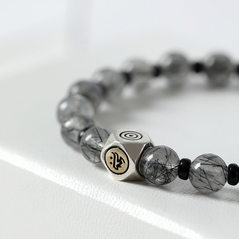 Guardian Buddha Sanskrit Mantra Black Rutilated Quartz Bracelet - Calm & Good Fortune - close-up shot