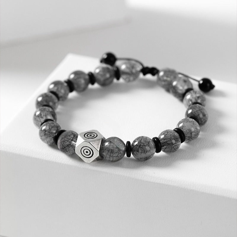 Guardian Buddha Sanskrit Mantra Black Rutilated Quartz Bracelet - Calm & Good Fortune - staged shot 1