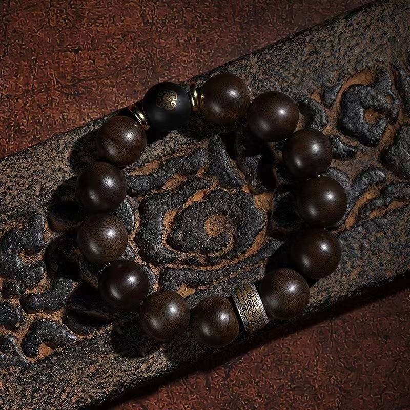 Guardian Chinese Zodiac Buddha Bracelet - Peace & Smooth Fortune - top view staged shot with agarwood main beads
