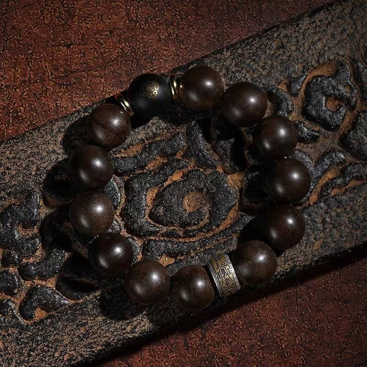 Guardian Chinese Zodiac Buddha Bracelet - Peace &amp; Smooth Fortune - top view staged shot with agarwood main beads