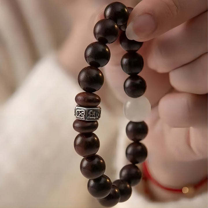 Guardian Sanskrit Zodiac Charm Aromatic Sandalwood Bracelet - Peace &amp; Smooth Fortune - close-up on-hand shot